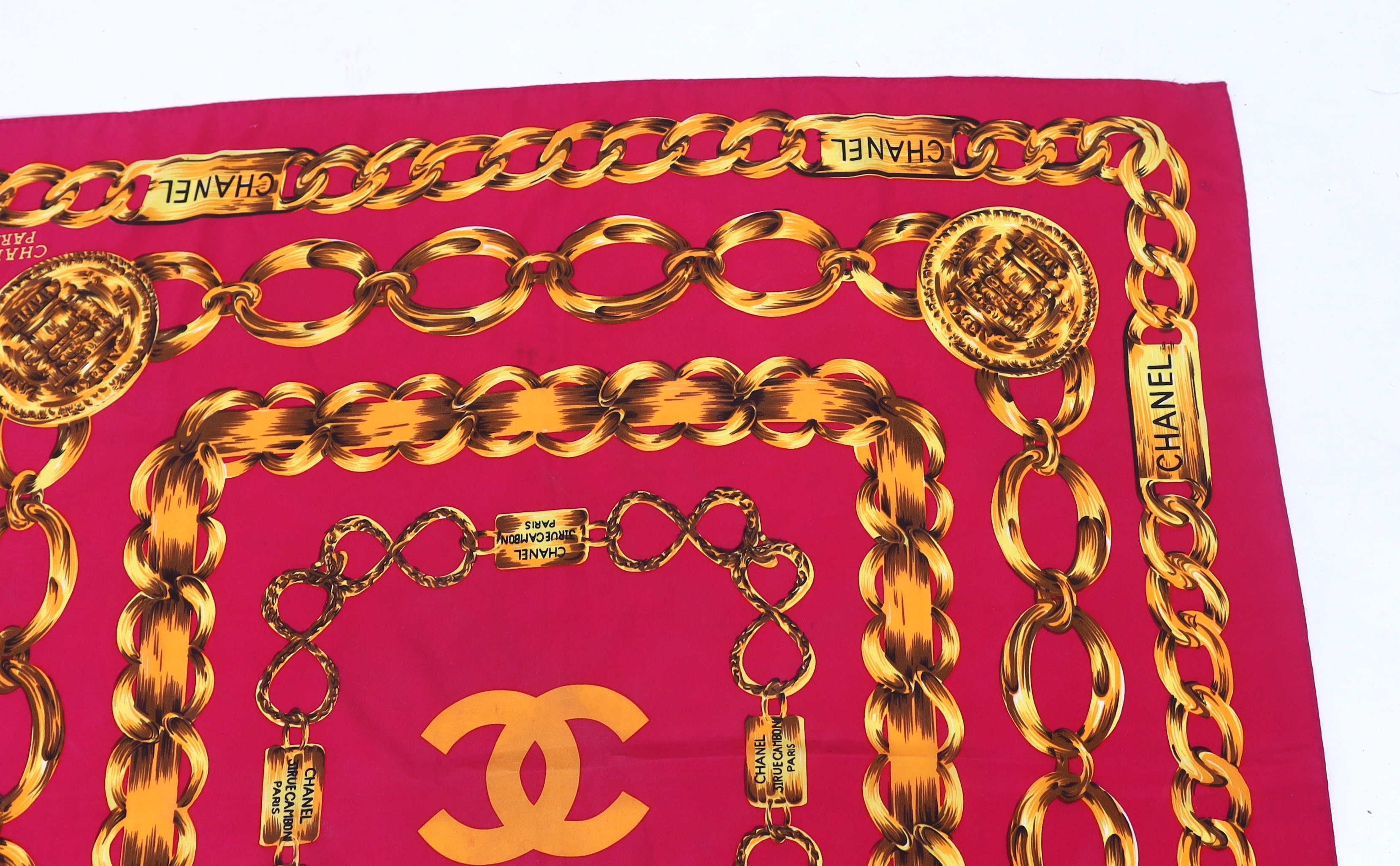 A Chanel Chain pink and gold silk scarf, 80cm x 80cm